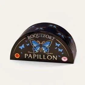 Половина головки Roquefort Papillon в чёрной упаковке с синей бабочкой